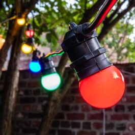 Vintage guinguette light garland with colored bulbs